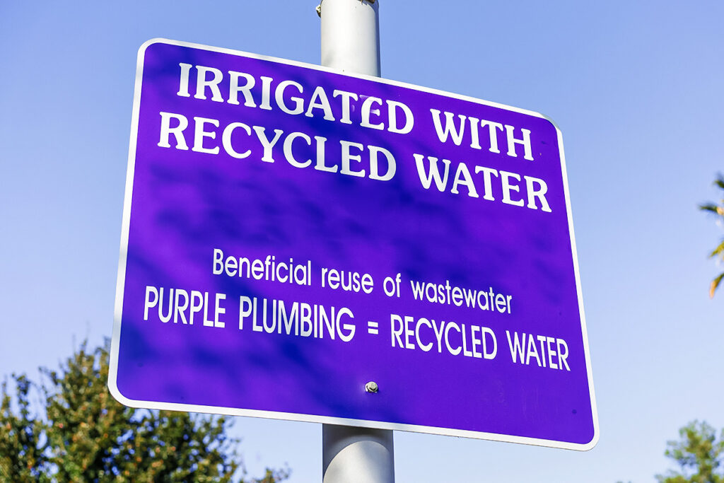 Photo of a sign that reads: irrigated with recycled water.