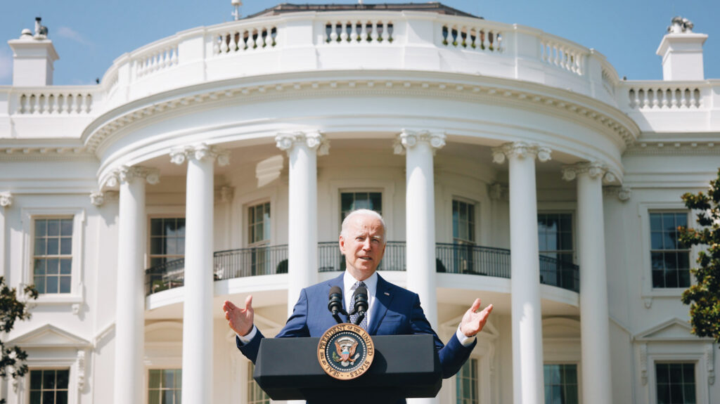 Photo of U.S. President Joe Biden speaking in front of the White House.